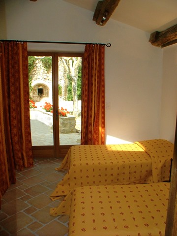 Provencal Mas, Mas des Oliviers - room Groundfloor level, access to the terrace. King or two twins. traditional beam